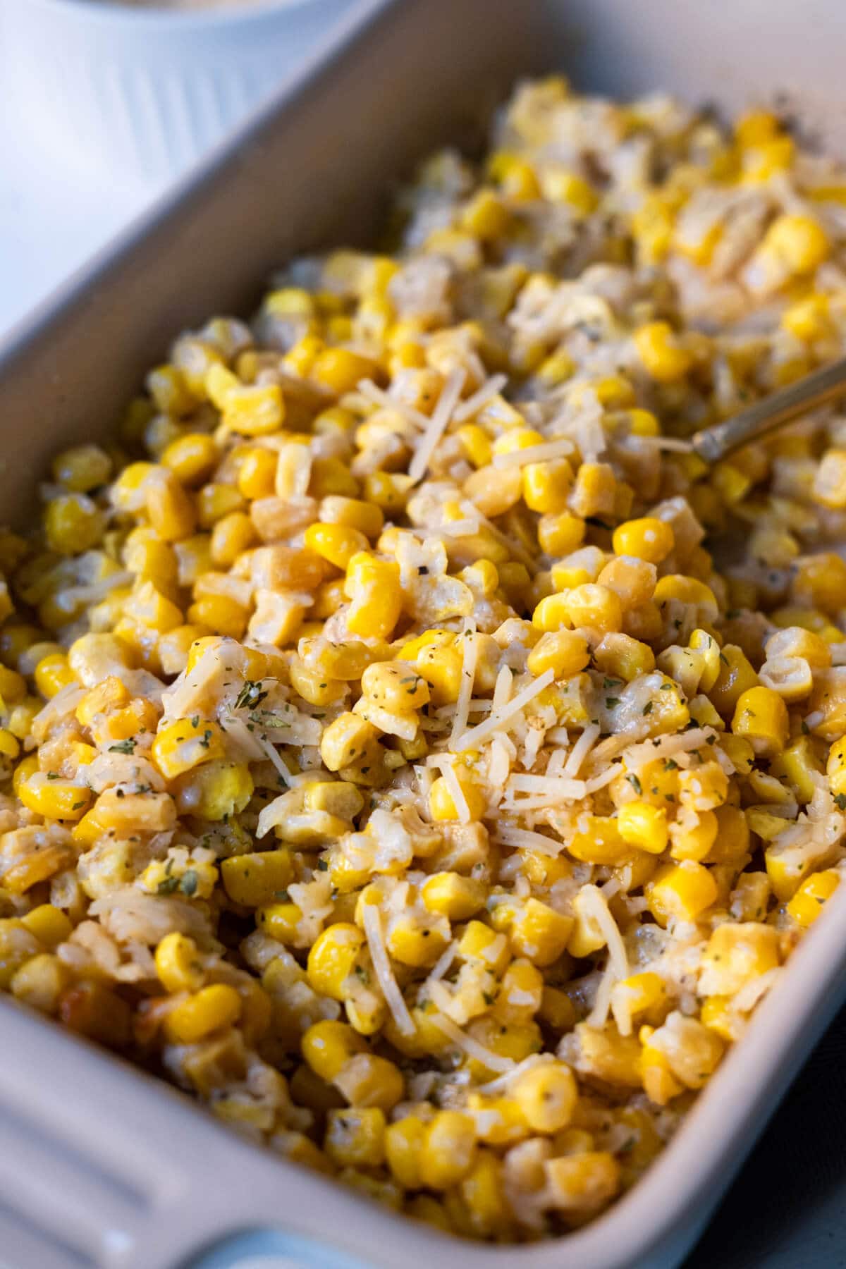 Baked parmesan cheese corn in a baking dish.
