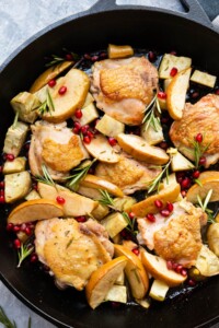 Apple cider glazed chicken with pomegranate sprinkled on top.