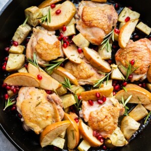 Apple cider glazed chicken thighs with rosemary, pomegranate sprinkled on top.