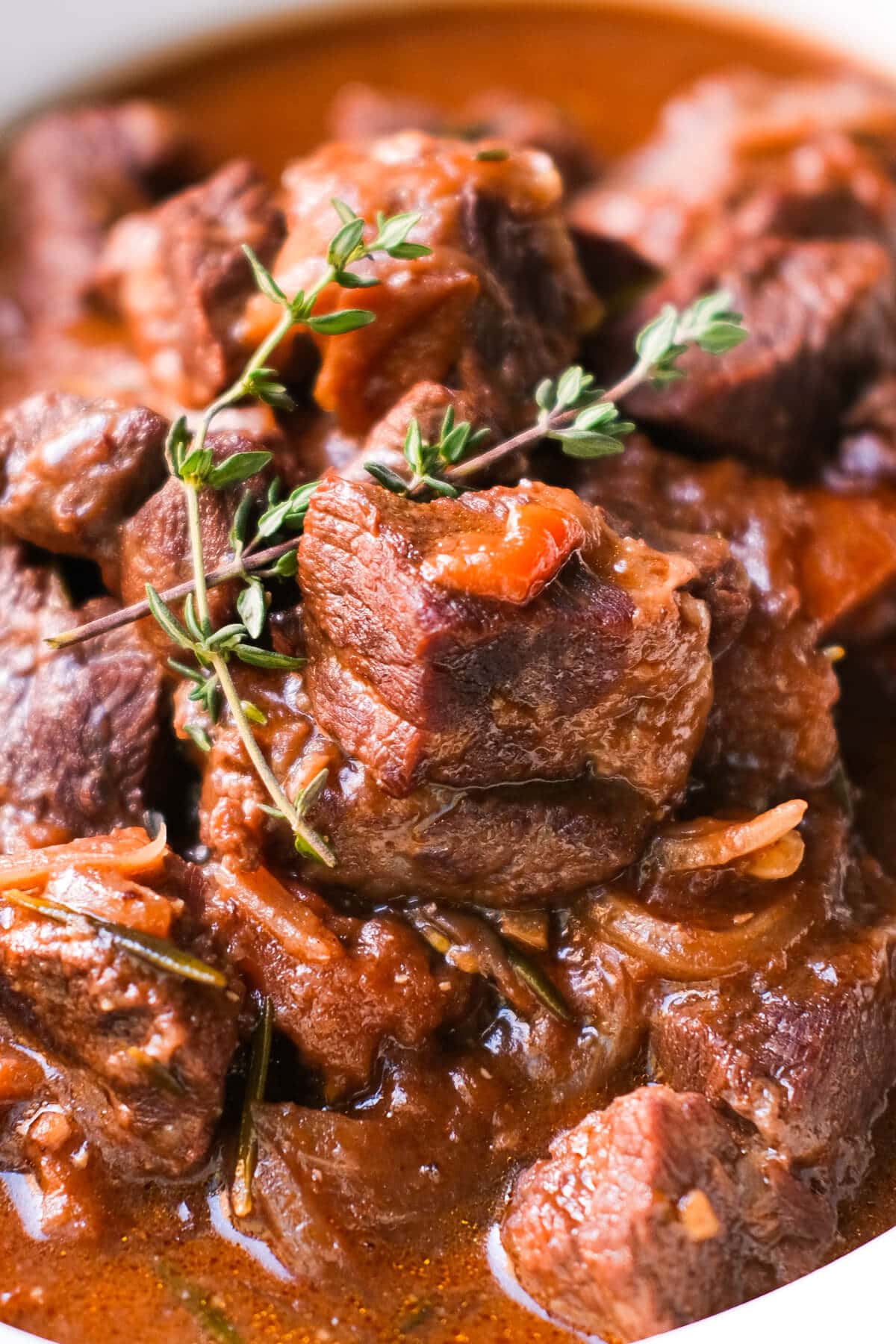 Tender, juicy braised beef soaked in tomato sauce and topped with fresh thyme.