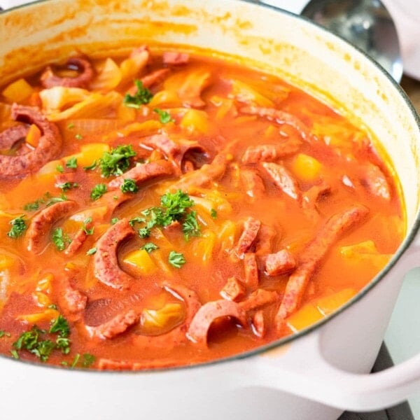 Rich Shanghai-style borscht soup in a pot with beef sausage, vegetables.