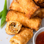 Crispy chicken egg rolls served with sweet chili sauce.