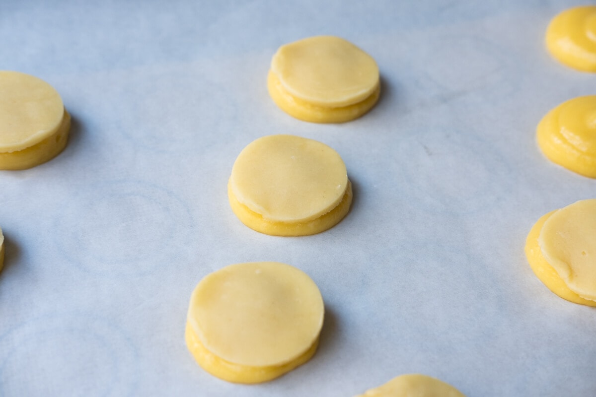 Place the top over the choux pastry dough.  