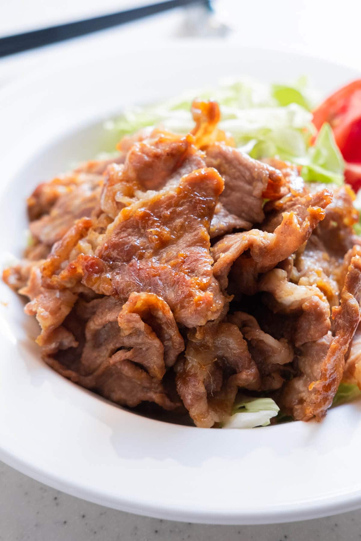 Tender, juicy pork slices coated with savory ginger sauce.