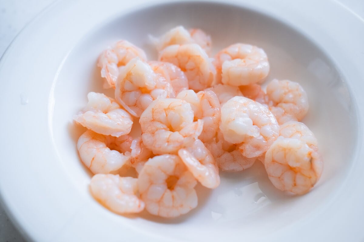 Boiled shrimp in a white bowl. 