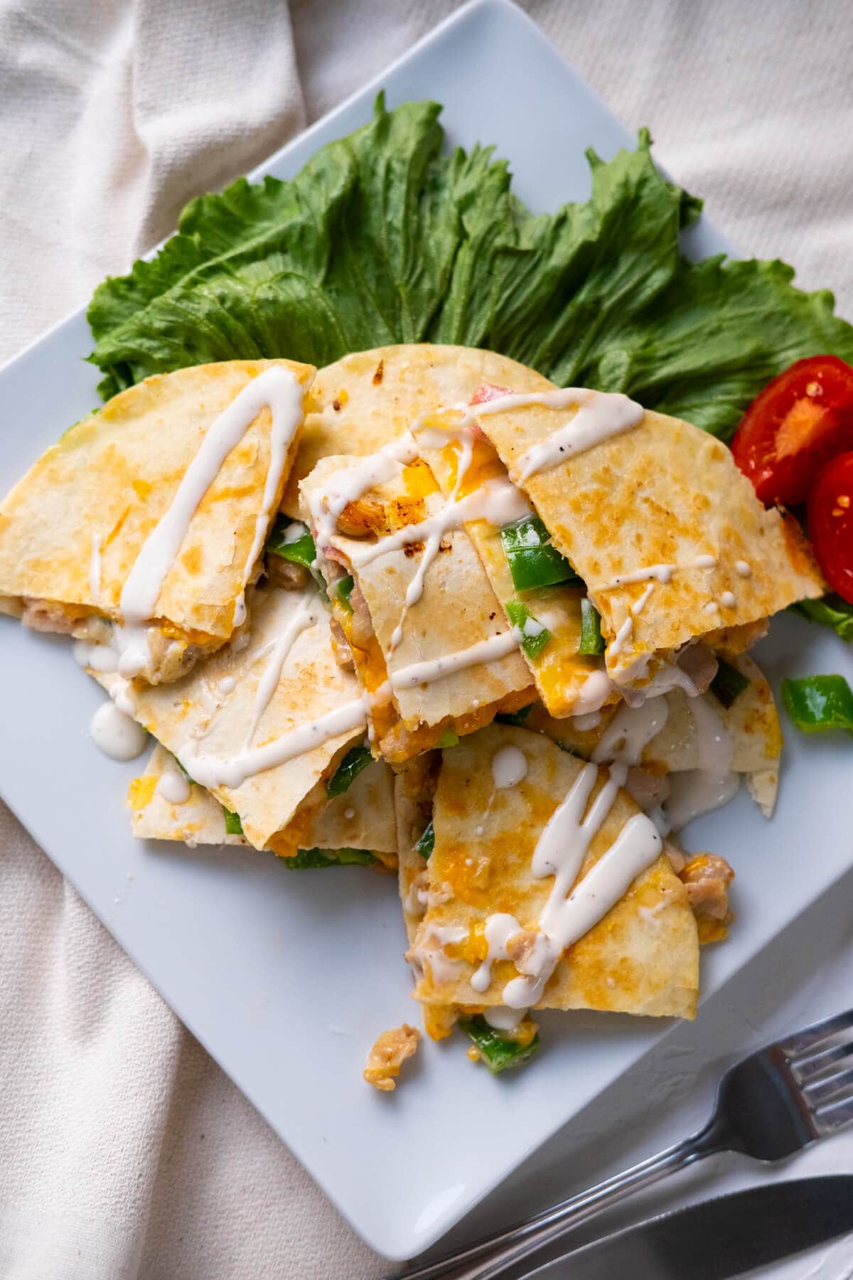 Chicken and bacon quesadilla with melty cheese and flavor chicken and bacon for its filling. 