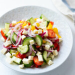Greek salad made from cucumber, bell peppers, and cherry tomatoes.