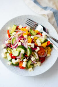 Refreshing Greek salad made with cucumber, bell peppers and cherry tomatoes.