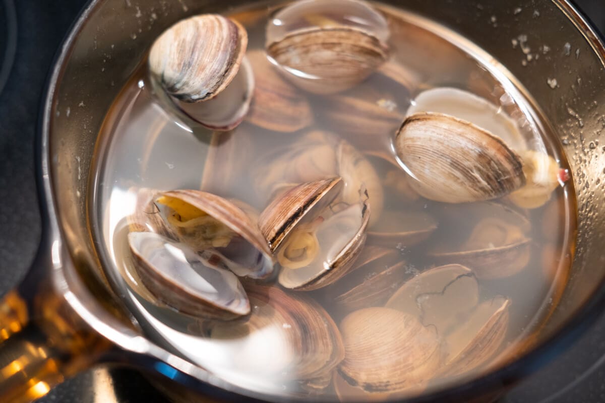 Fresh clams boiling in a pot. 