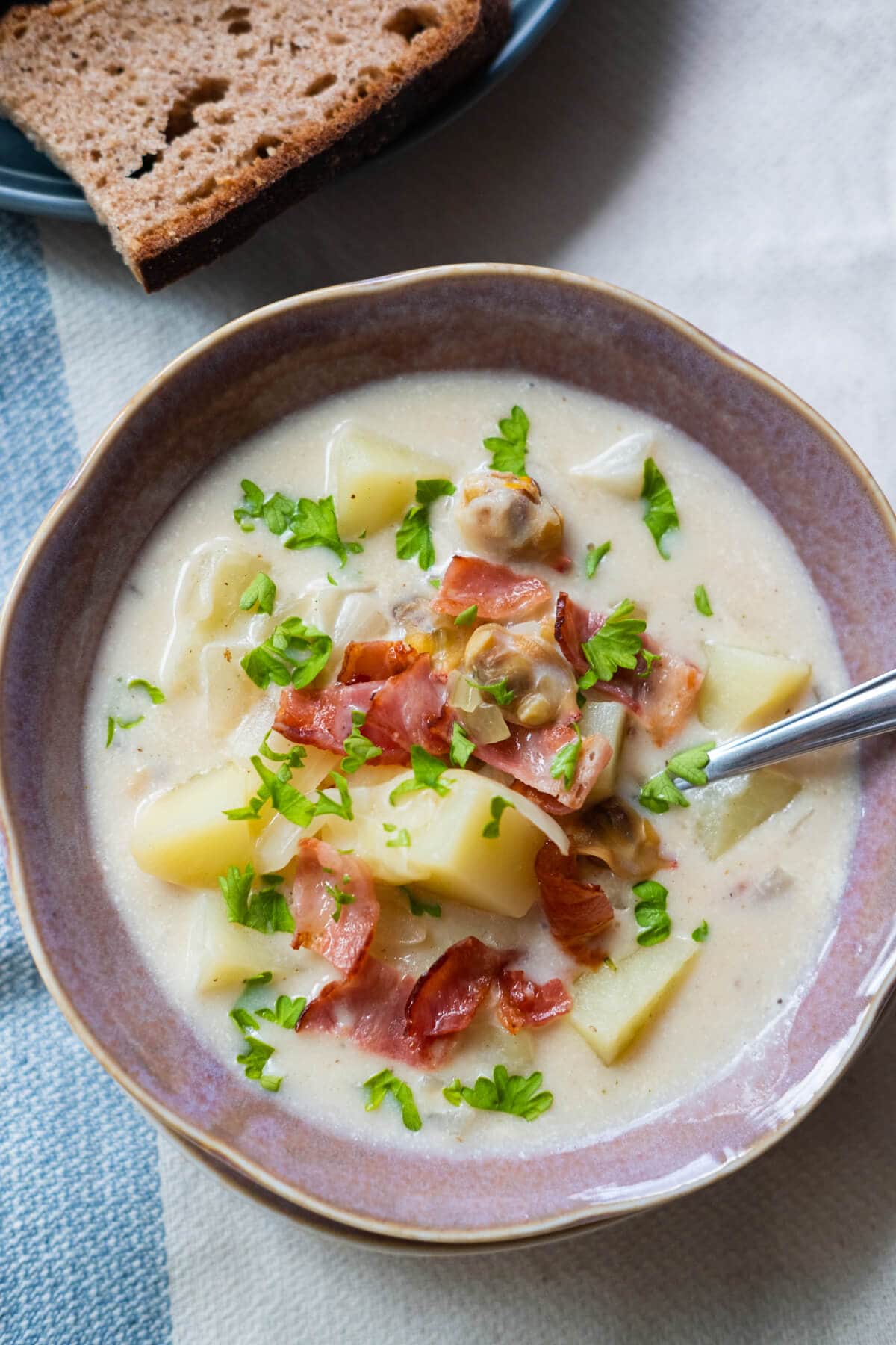 Potato clam chowder with crispy bacon on top. 