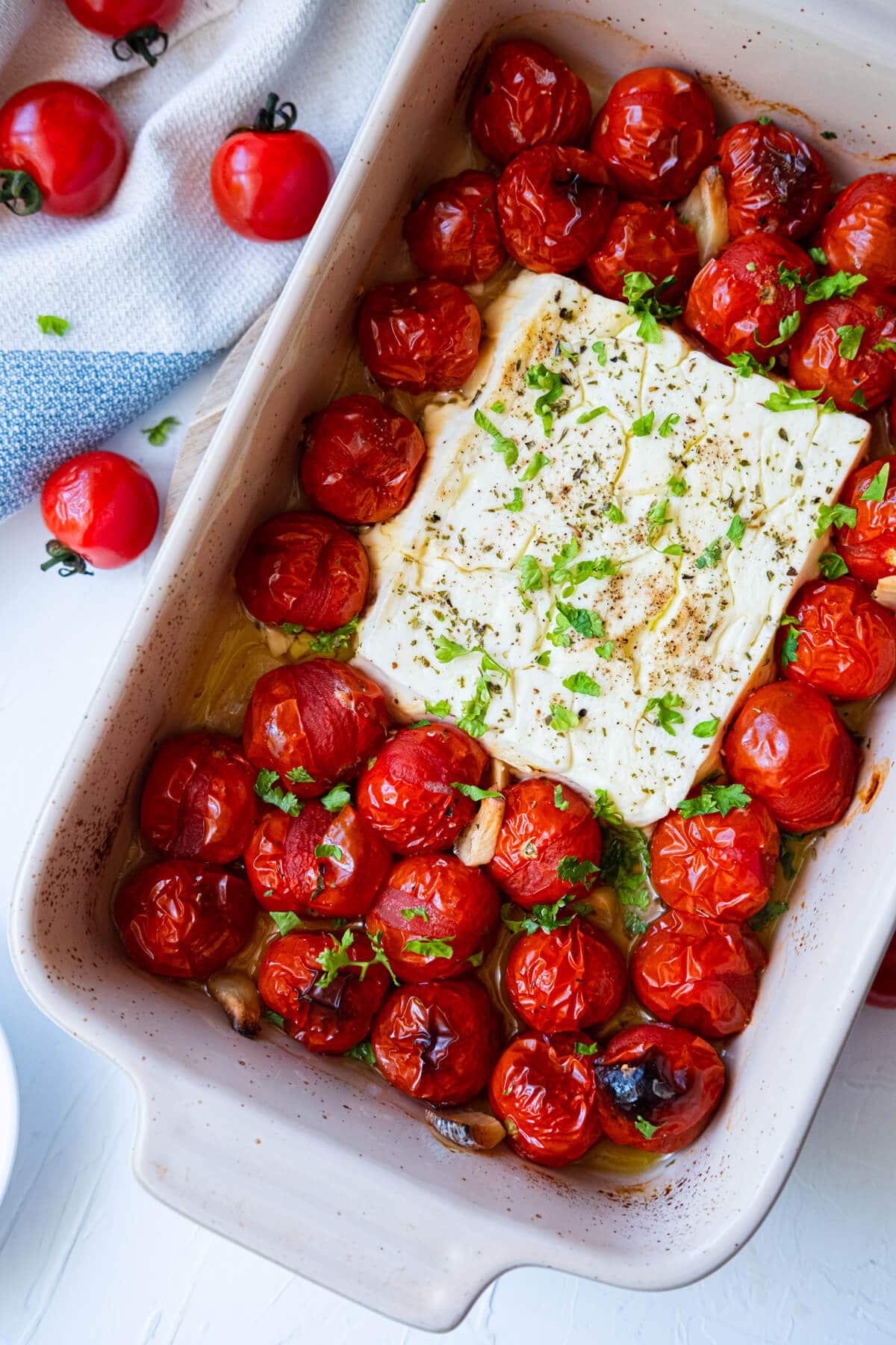 Easy and quick baked tomato and feta topped with chopped parsley. 