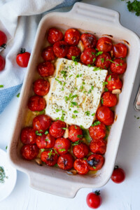 Baked tomato and feta in a baking dish.