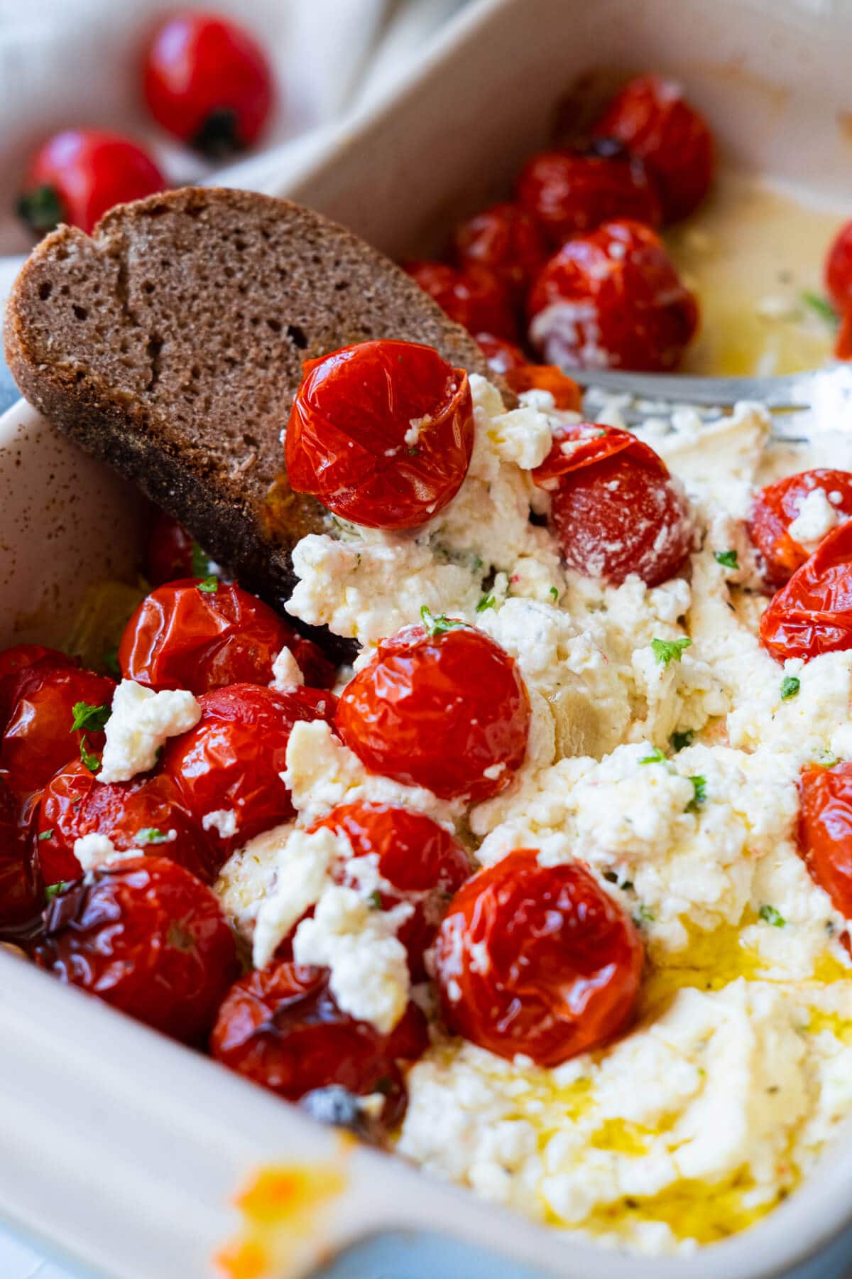 Dip the crusty bread in baked tomato and feta. 