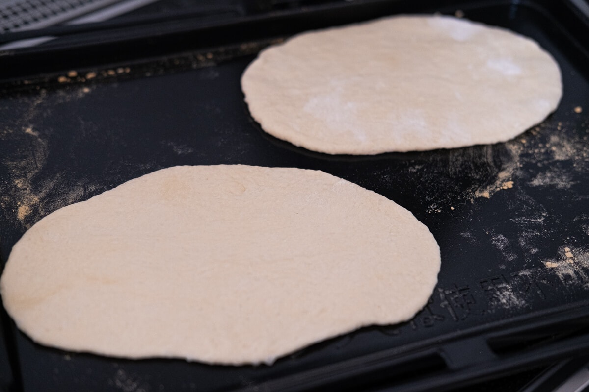 Shape and roll out the pita bread. 