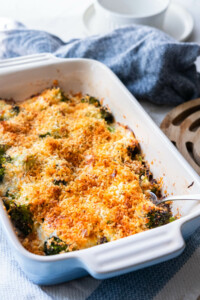 Easy broccoli gratin baked in a baking dish and topped with bread crumbs.