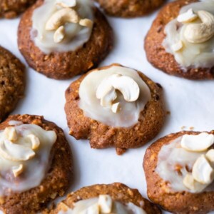 Cashew cookies recipe with frosting and cashew halves on top.