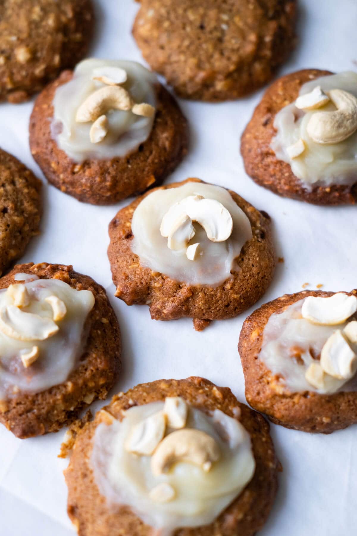 Delicious round cashew cookies with cashew and frosting on top. 