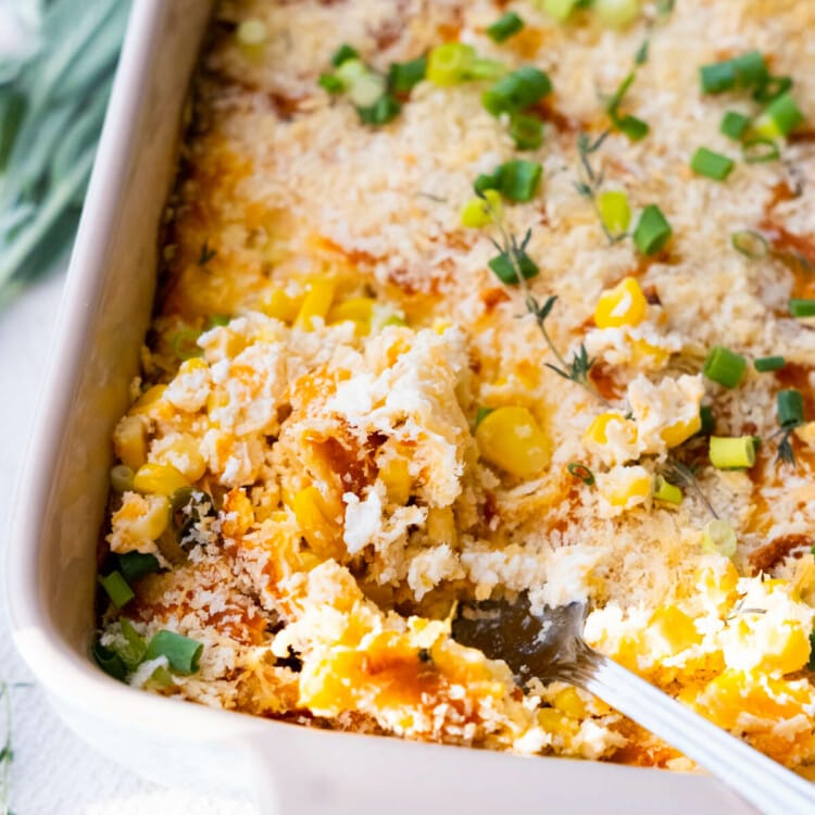 The extremely cheesy corn casserole with crispy topping of bread crumbs and green onion.