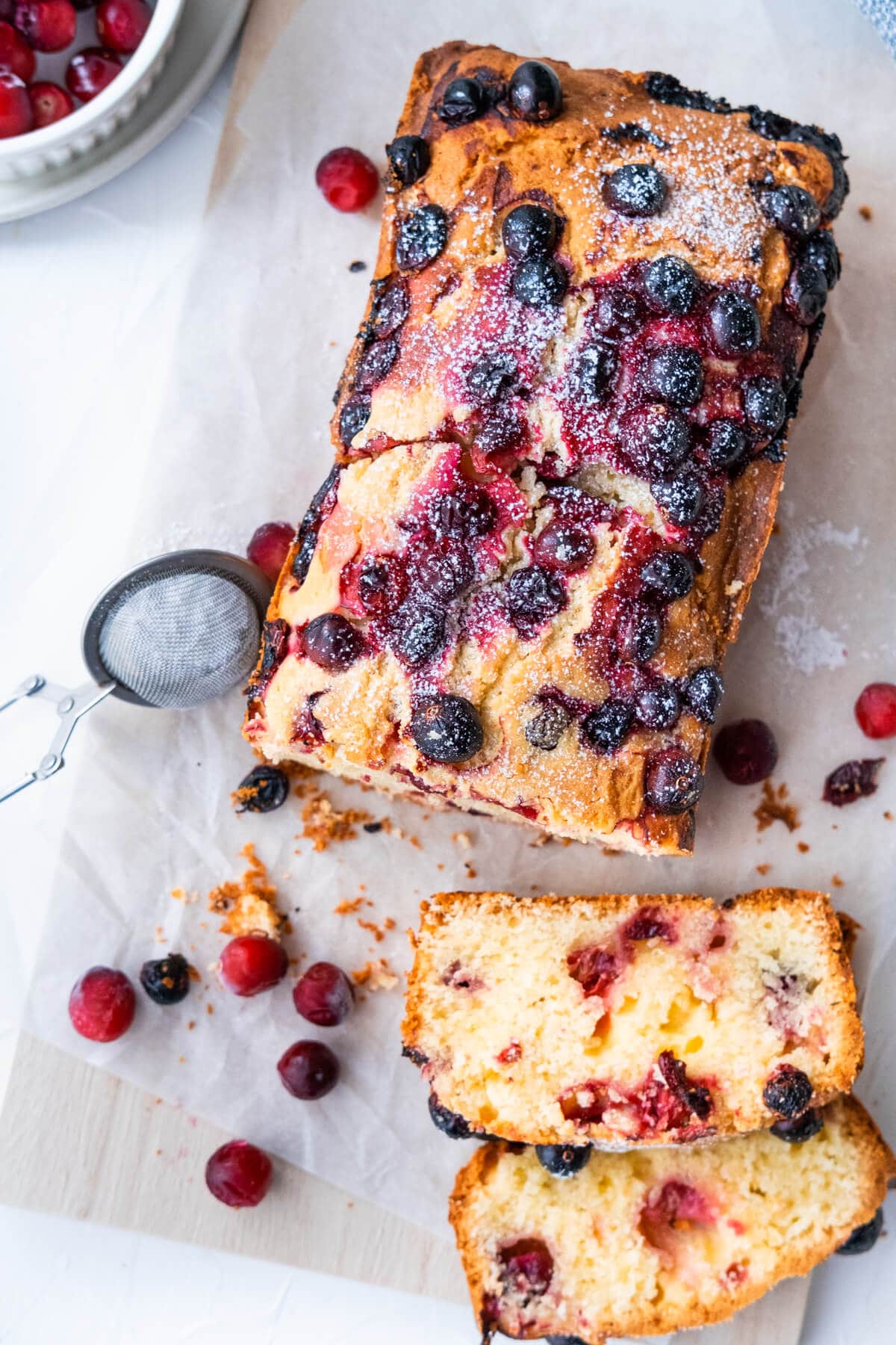 Crumbly cranberry cake sliced in pieces. 