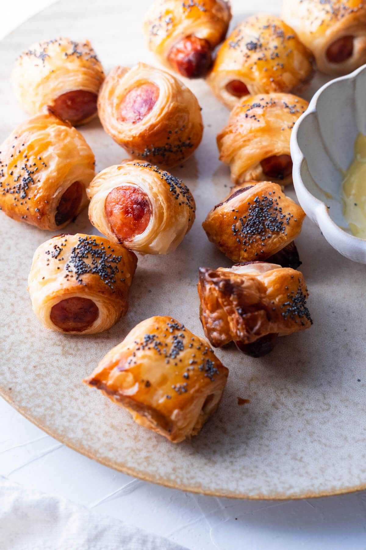 Pigs in blankets with juicy hot dogs wrapped in flaky pastry. 