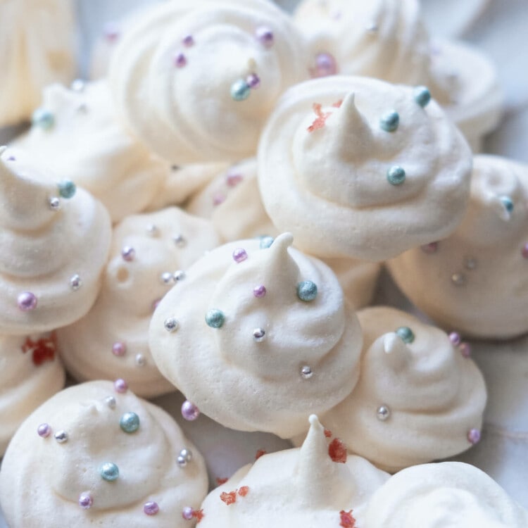 Easy and quick vanilla meringue cookies served on a white plate.