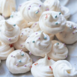 Vanilla meringue cookies with sprinkles.