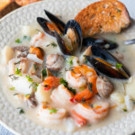 Seafood chowder loaded with clams, mussels, prawns, and fish.