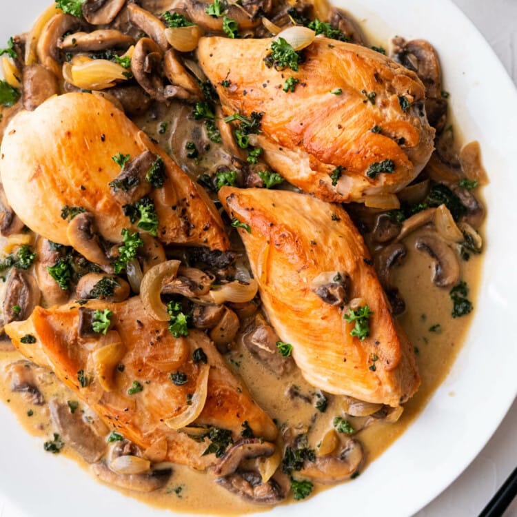 Chicken diane yields seared chicken breasts in a creamy Diane sauce and garnish with freshly chopped parsley.