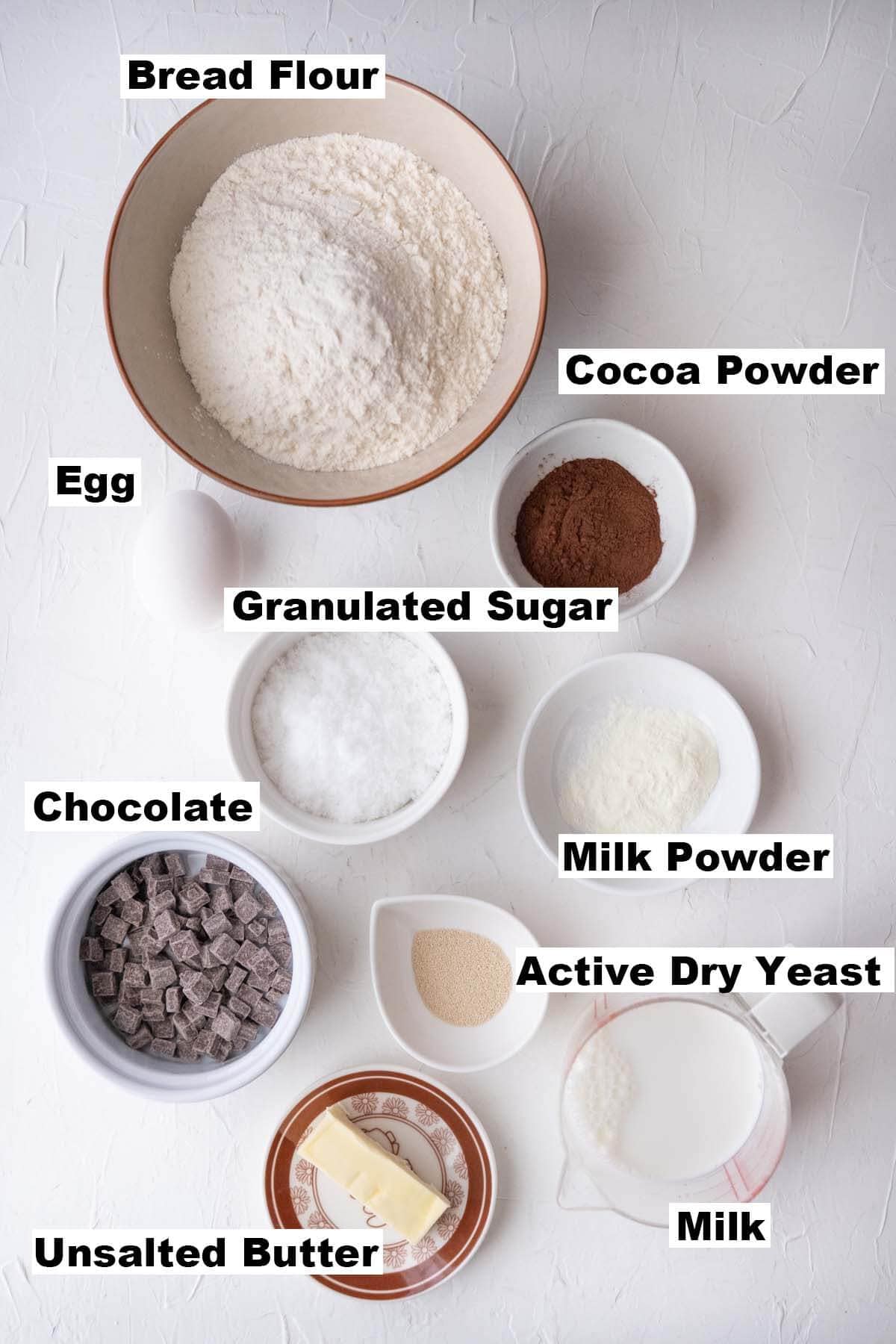 A picture shows the ingredients of double chocolate milk buns recipe. 