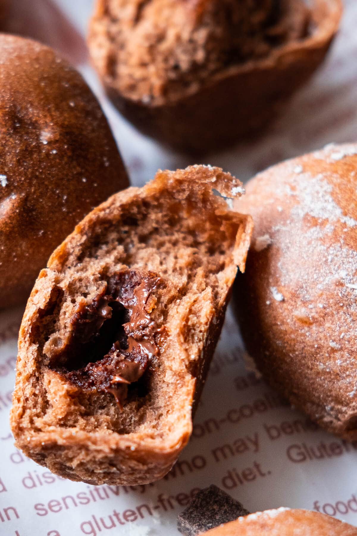 A close up on soft chocolate milk buns with melting chocolate in the center. 