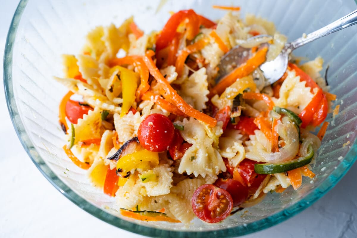 Add cherry tomato halves and all baked vegetables in a bowl and toss well with farfalle.  