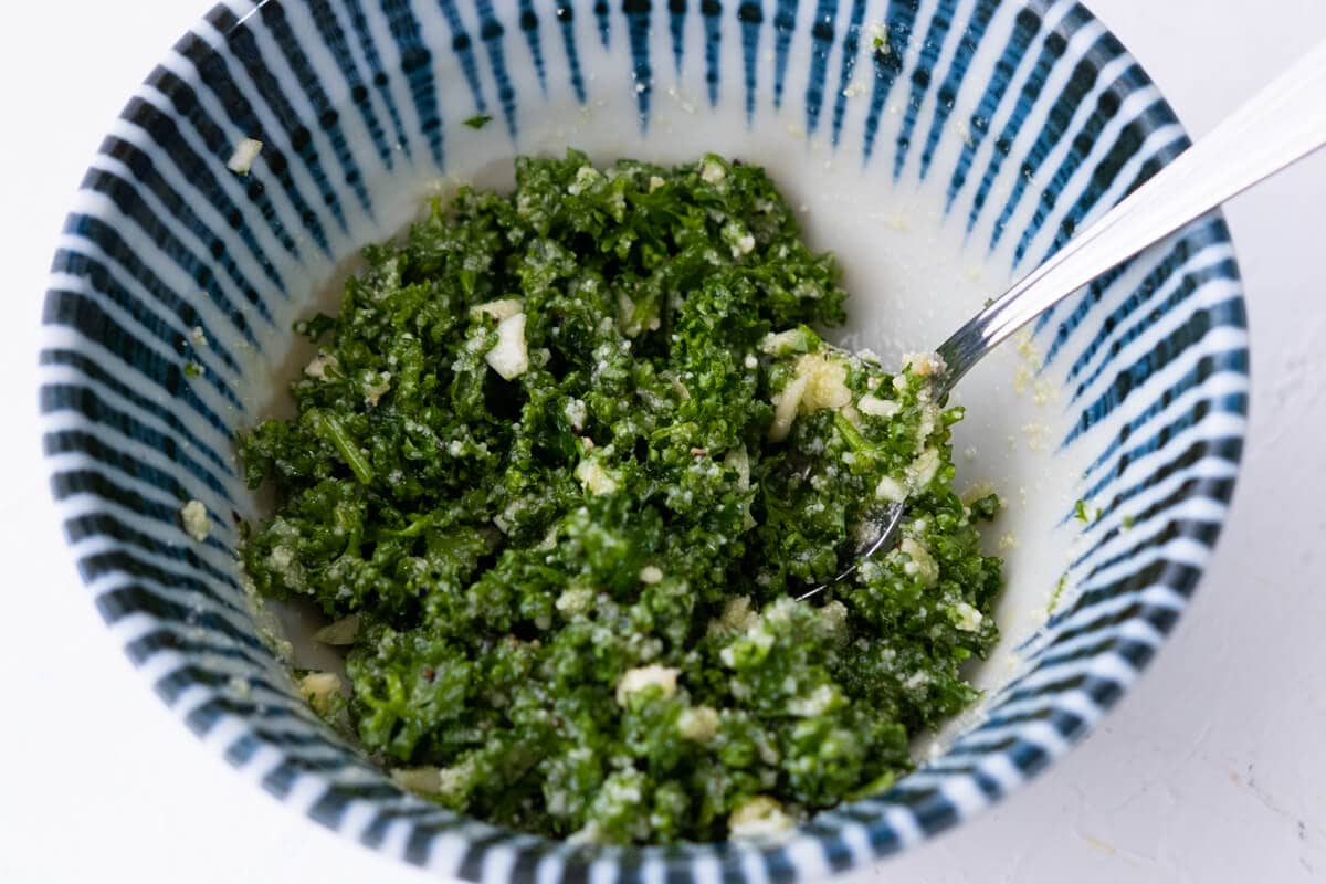 Mix olive oil, parsley, grated parmesan cheese, garlic, salt and ground black pepper in a small bowl. 
