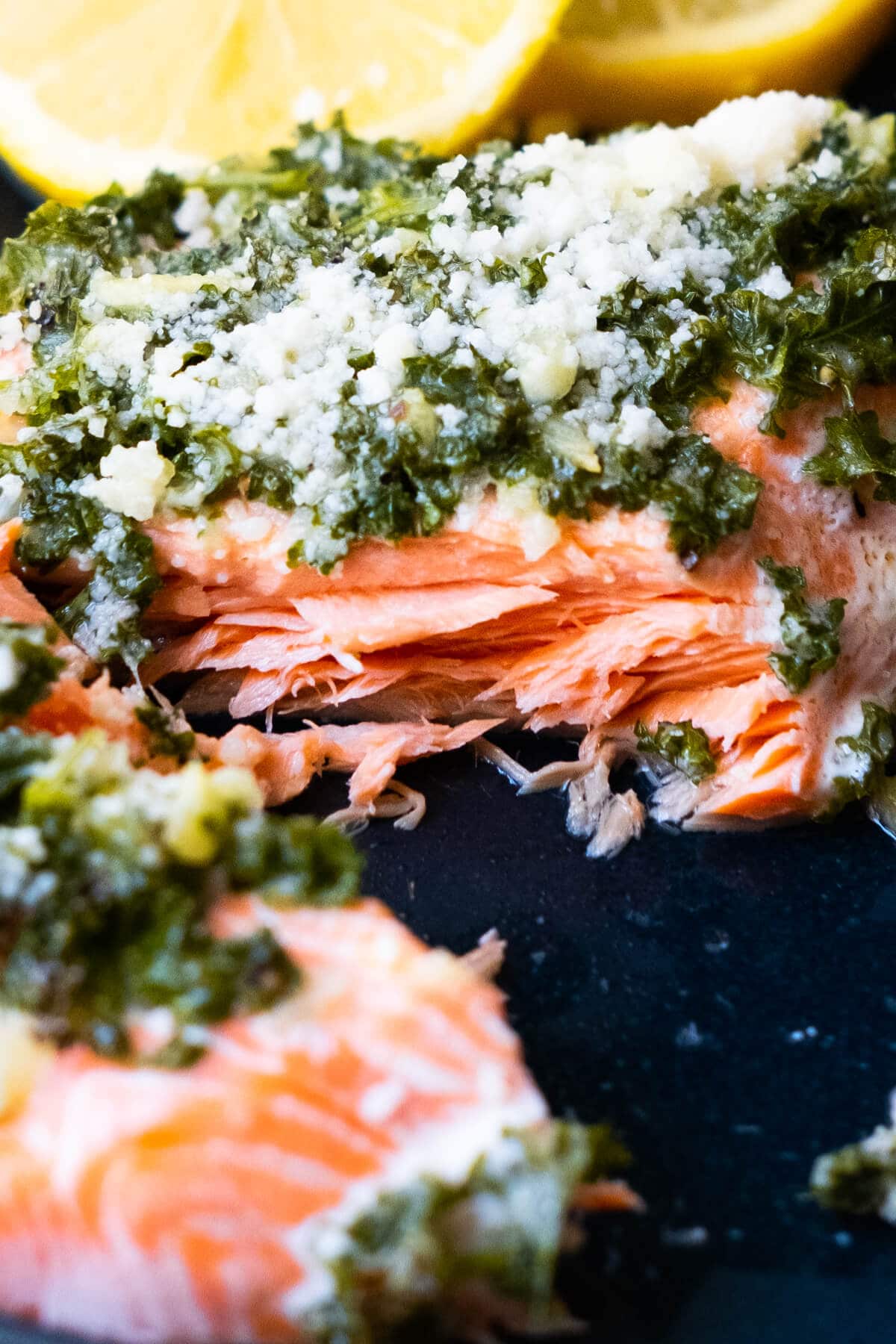 A picture close up on the center of the baked salmon and top with parsley mixture. 