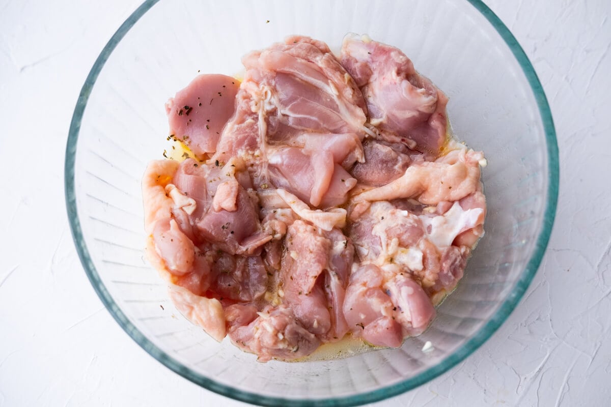 Marinate chicken thighs in a large bowl. 