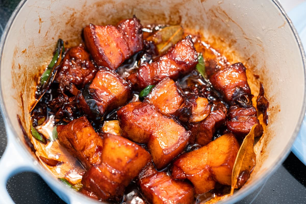 Braised pork belly in a pot glazed with thicken red sauce.