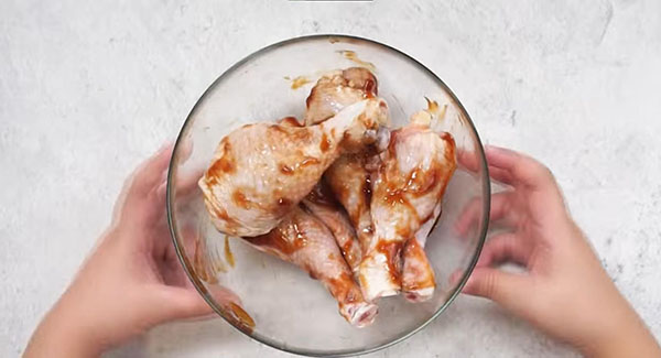 This image shows the Chicken Drumsticks being marinated.