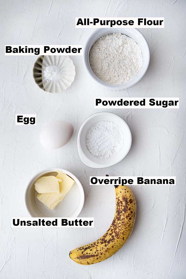This image consists of ingredients used in the Banana Cake recipe.