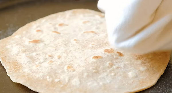 This image shows the Chapati being cooked on the gridle.