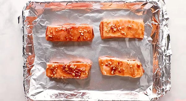 This image shows the marinated pork belly on a baking tray.