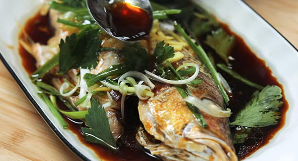 This image shows the Steamed Fish ready to be served.