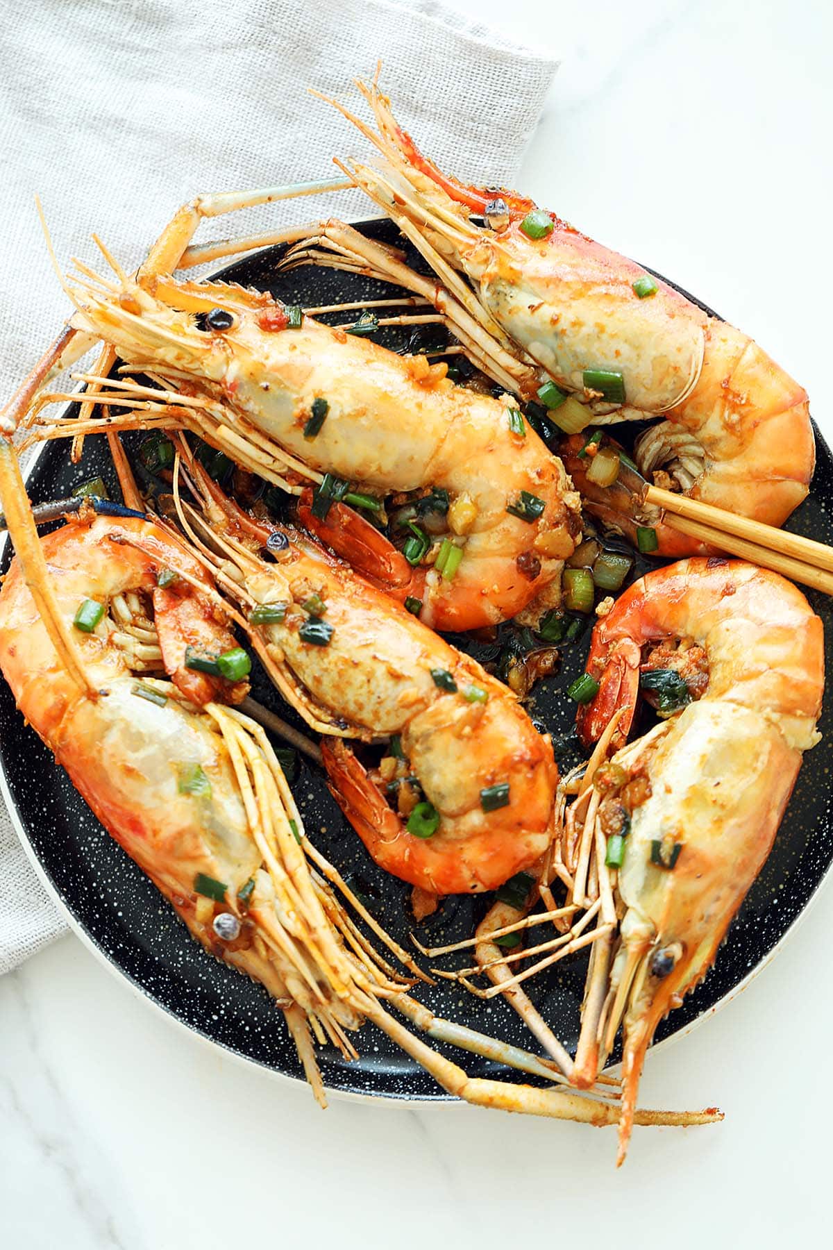Perfectly cooked fresh water prawns garnished with chopped scallions. 