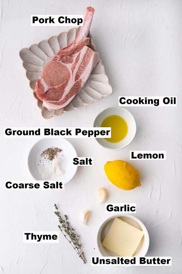 This image consists of ingredients such as pork chops, cooking oil, ground black pepper, salt, lemon, thyme and unsalted butter for the Garlic Butter Pork Chops recipe.