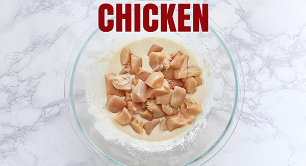 This image shows the raw chicken combined with the frying batter.