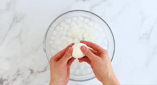 This image shows the eggs being peeled.