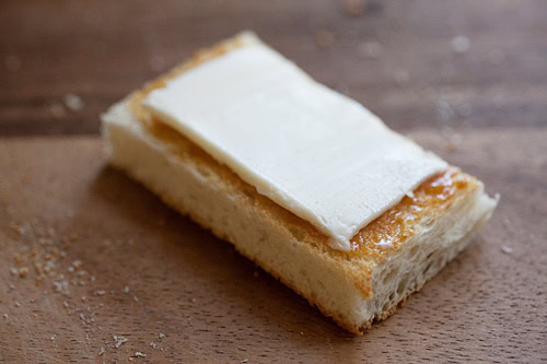 This image shows a slice of cold butter on top of the kaya.