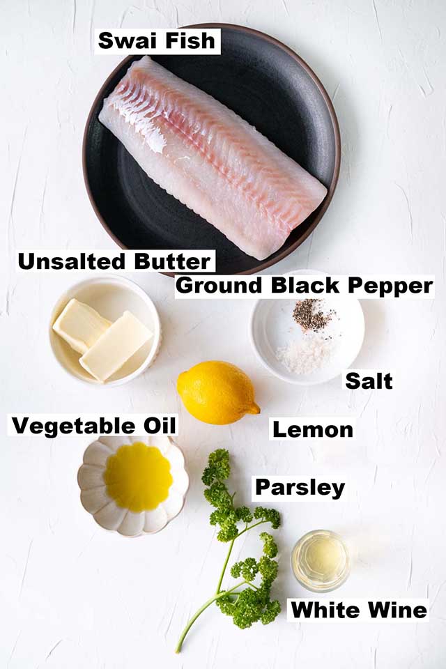 Ingredients for Lemon Butter Swai Fish recipe such as Swai fish, unsalted butter, ground black pepper, salt, vegetable oil, lemon, parsley and white wine.