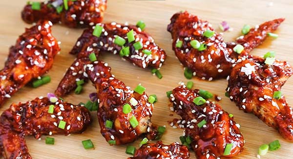 Coated Korean chicken wings ready to be served.