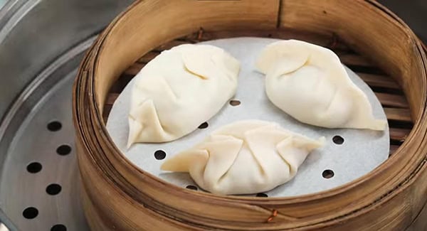 This image shows the Dumplings being steamed.