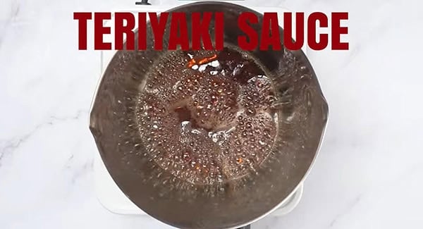 Teriyaki sauce in sauce pan boiling. 