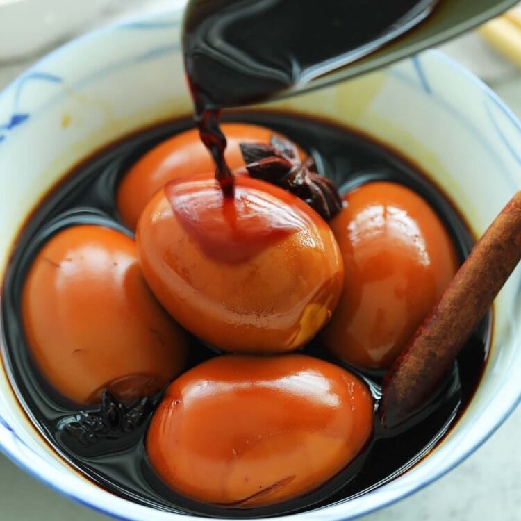 Delicious braised eggs in soy sauce in a bowl.
